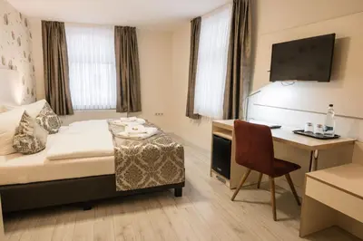 Ein Bett oder Betten in einem Zimmer der Unterkunft Novel Hotel