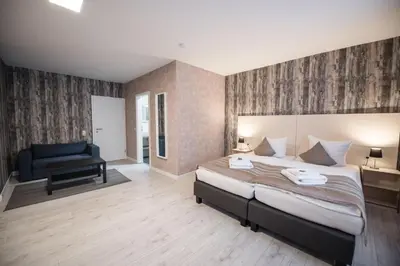 Ein Bett oder Betten in einem Zimmer der Unterkunft Novel Hotel