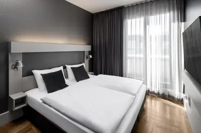Ein Bett oder Betten in einem Zimmer der Unterkunft Hotel AMANO Rooms & Apartments