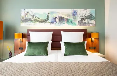 Ein Bett oder Betten in einem Zimmer der Unterkunft Leonardo Royal Hotel Berlin Alexanderplatz