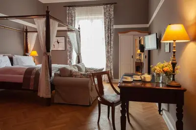 Ein Bett oder Betten in einem Zimmer der Unterkunft Schlosshotel Ziethen
