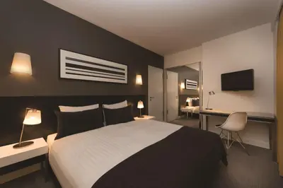 Ein Bett oder Betten in einem Zimmer der Unterkunft Adina Apartment Hotel Berlin Hackescher Markt
