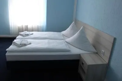 Ein Bett oder Betten in einem Zimmer der Unterkunft Hotel am Fluss