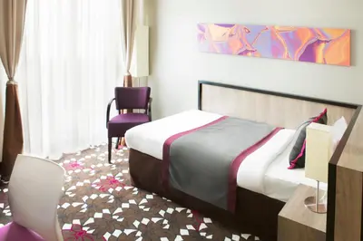 Ein Bett oder Betten in einem Zimmer der Unterkunft Hotel MOA Berlin