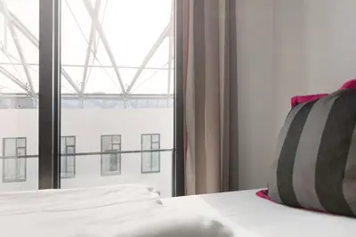 Ein Bett oder Betten in einem Zimmer der Unterkunft Hotel MOA Berlin