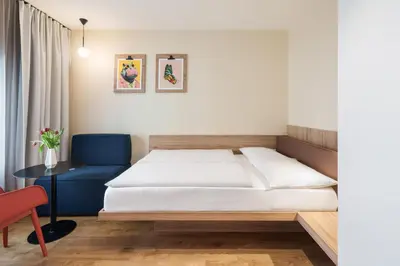 Ein Bett oder Betten in einem Zimmer der Unterkunft smartments Berlin Prenzlauer Berg