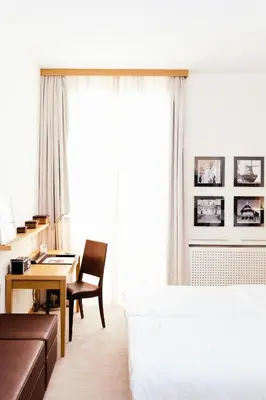 Ein Bett oder Betten in einem Zimmer der Unterkunft Hotel Brandenburger Tor Potsdam