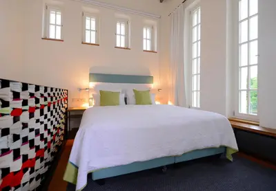 Ein Bett oder Betten in einem Zimmer der Unterkunft Wasserwerk Bad Saarow