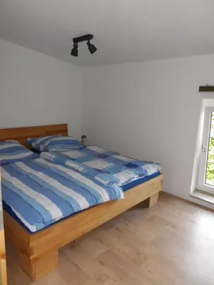 Ein Bett oder Betten in einem Zimmer der Unterkunft Hopfenkammer Schorfheide
