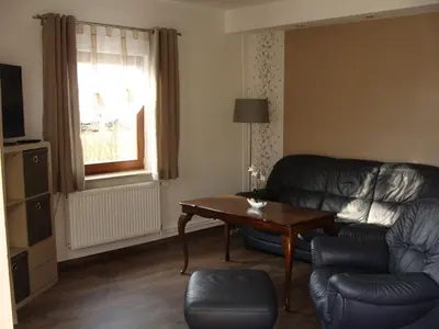 Ein Sitzbereich in der Unterkunft Ferienwohnung Rohrwallinsel Köpenick