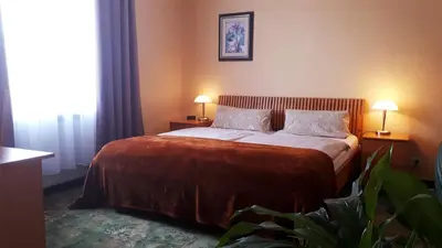 Ein Bett oder Betten in einem Zimmer der Unterkunft Hotel Krone Lindow