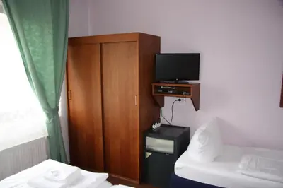 Ein Bett oder Betten in einem Zimmer der Unterkunft Hotel Zum goldenen Stern
