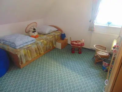 Ein Bett oder Betten in einem Zimmer der Unterkunft Ferienhaus Emmelie