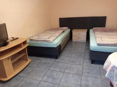 Ein Bett oder Betten in einem Zimmer der Unterkunft Gästezimmer Sommer Locktow