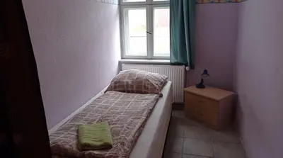 Ein Bett oder Betten in einem Zimmer der Unterkunft Gästezimmer Sommer Locktow