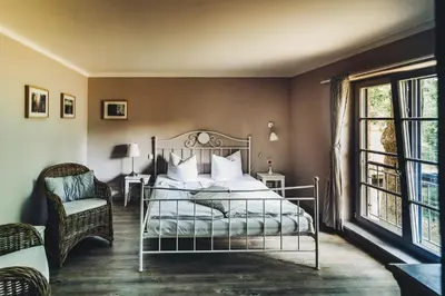 Ein Bett oder Betten in einem Zimmer der Unterkunft Pension Alter Hafen