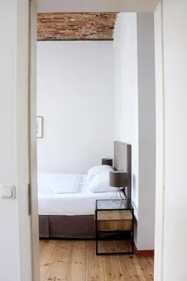 Ein Bett oder Betten in einem Zimmer der Unterkunft berlincity