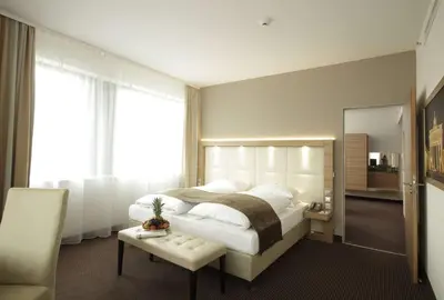 Ein Bett oder Betten in einem Zimmer der Unterkunft H4 Hotel Berlin Alexanderplatz