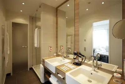 Ein Badezimmer in der Unterkunft H4 Hotel Berlin Alexanderplatz