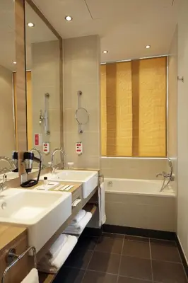 Ein Badezimmer in der Unterkunft H4 Hotel Berlin Alexanderplatz