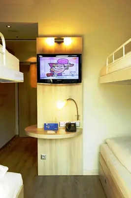 Ein Bett oder Betten in einem Zimmer der Unterkunft H2 Hotel Berlin-Alexanderplatz