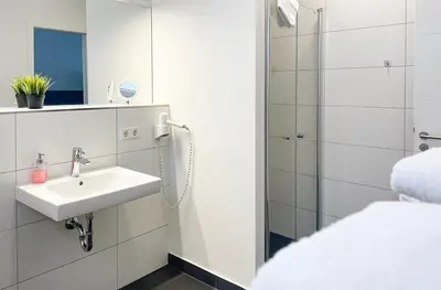 Ein Badezimmer in der Unterkunft PRIMA Inn Ferienwohnungen Seetor Residenz