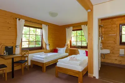 Ein Bett oder Betten in einem Zimmer der Unterkunft Hotel & Restaurant Wilder Eber