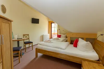 Ein Bett oder Betten in einem Zimmer der Unterkunft Hotel & Restaurant Wilder Eber