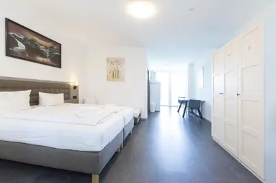 Ein Bett oder Betten in einem Zimmer der Unterkunft Hotel Pension Odin