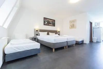 Ein Bett oder Betten in einem Zimmer der Unterkunft Hotel Pension Odin