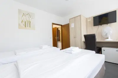 Ein Bett oder Betten in einem Zimmer der Unterkunft Hotel Pension Odin