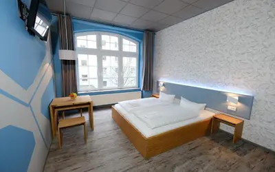 Ein Bett oder Betten in einem Zimmer der Unterkunft Singer109 Hostel, Hotel & Apartment