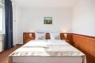 Ein Bett oder Betten in einem Zimmer der Unterkunft Hotel Aldea Berlin