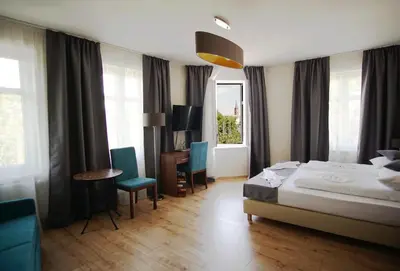 Ein Bett oder Betten in einem Zimmer der Unterkunft Hotel Bett und Buch