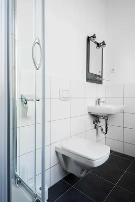 Ein Badezimmer in der Unterkunft Queens Park Hotel