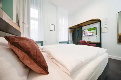 Ein Bett oder Betten in einem Zimmer der Unterkunft Arco Smart Hotel Berlin