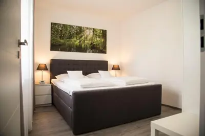 Ein Bett oder Betten in einem Zimmer der Unterkunft Spreehaus-Apartments