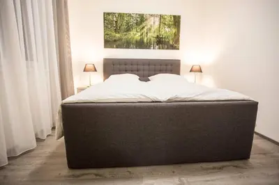 Ein Bett oder Betten in einem Zimmer der Unterkunft Spreehaus-Apartments
