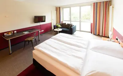 Ein Bett oder Betten in einem Zimmer der Unterkunft Aparion Apartments Berlin