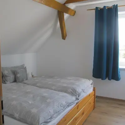 Ein Bett oder Betten in einem Zimmer der Unterkunft Ferienwohnungen Pustane