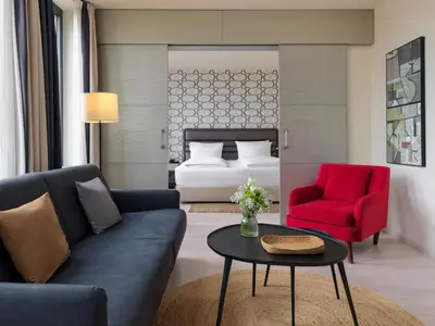 Ein Bett oder Betten in einem Zimmer der Unterkunft H10 Berlin Ku'Damm