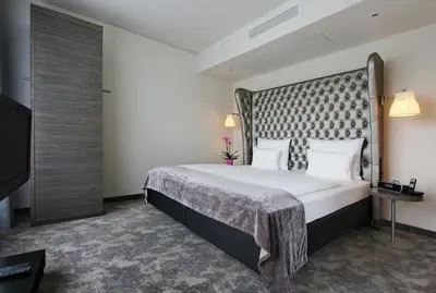 Ein Bett oder Betten in einem Zimmer der Unterkunft ARCOTEL John F Berlin