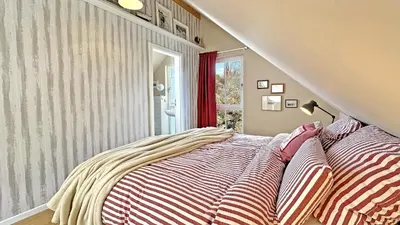 Ein Bett oder Betten in einem Zimmer der Unterkunft Am Inselufer