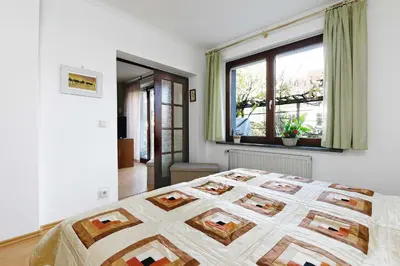 Ein Bett oder Betten in einem Zimmer der Unterkunft Cottage near centrum, paradise