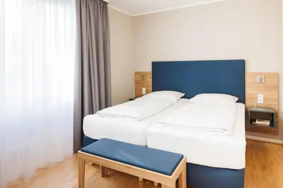 Ein Bett oder Betten in einem Zimmer der Unterkunft Hapimag Ferienwohnungen Berlin Zoo
