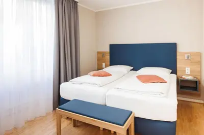 Ein Bett oder Betten in einem Zimmer der Unterkunft Hapimag Ferienwohnungen Berlin Zoo