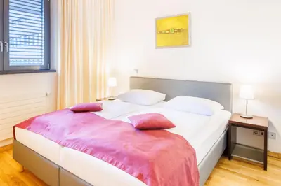Ein Bett oder Betten in einem Zimmer der Unterkunft Hapimag Berlin Gendarmenmarkt