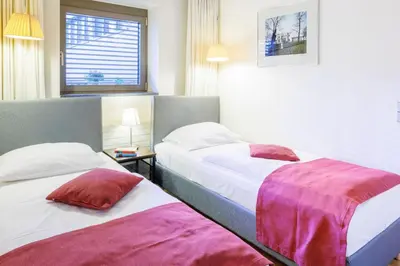 Ein Bett oder Betten in einem Zimmer der Unterkunft Hapimag Berlin Gendarmenmarkt