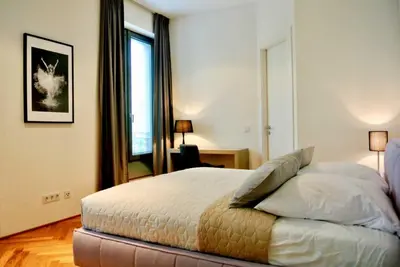 Ein Bett oder Betten in einem Zimmer der Unterkunft BonusFeature Apartments