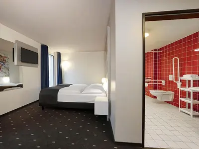 Ein Bett oder Betten in einem Zimmer der Unterkunft B&B HOTEL Berlin-Alexanderplatz